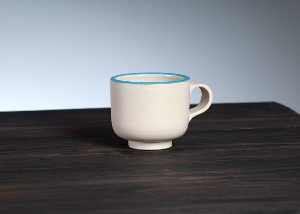 front view of espresso cup with blue rim