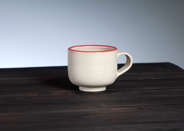 front view of espresso cup with red rim