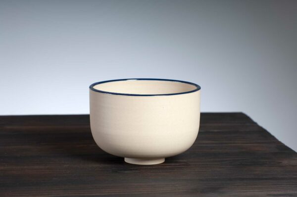 front view of bowl with navy rim