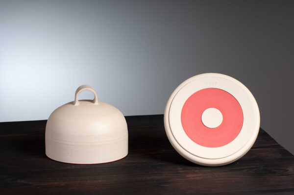 bottom view of Butter dish with red rim.