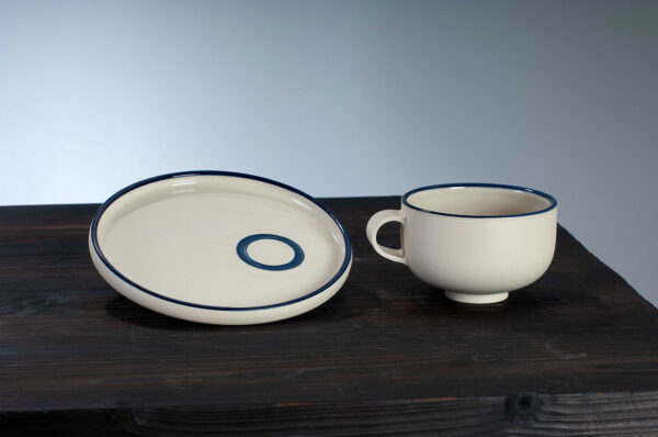 cappuccino cup and saucer set with navy rim side by side