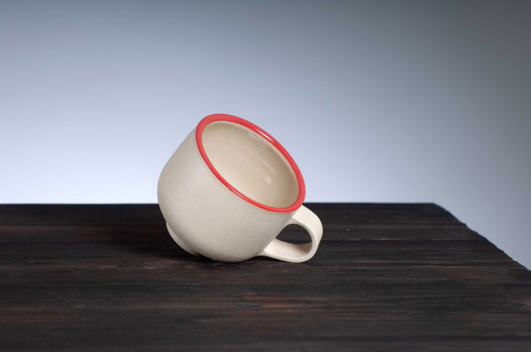 top view of coffee cup with red rim