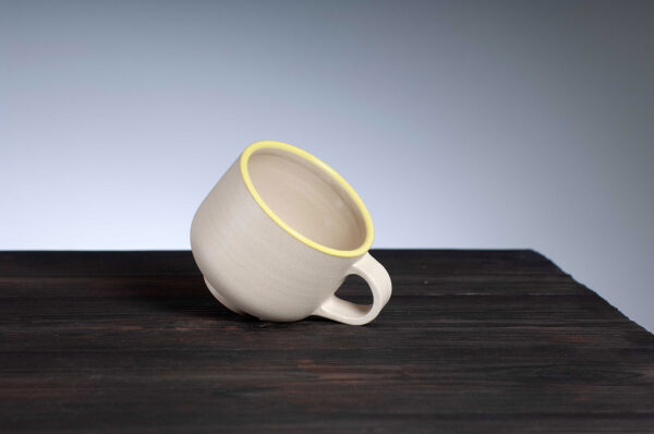 top view of coffee cup with yellow rim