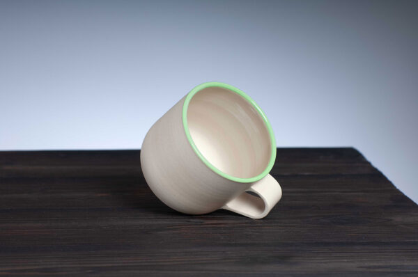 top view of stoneware mug with green rim