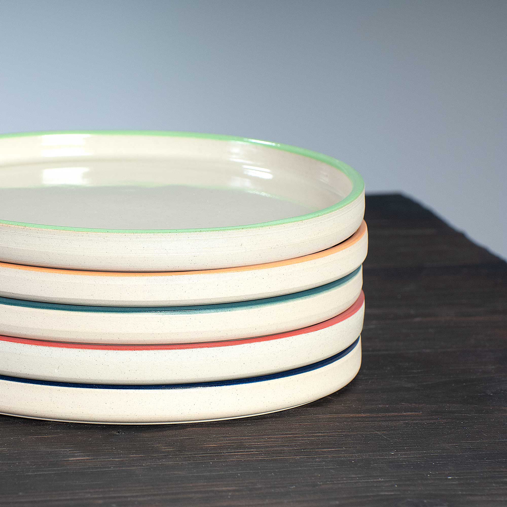 detail of stacked selection of side plates in range of colours